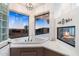Bright primary bath featuring a corner tub, a cozy fireplace, and breathtaking exterior sunset views and modern finishes at 7631 N 20Th St, Phoenix, AZ 85020