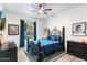 Comfortable bedroom with decorative rug, ceiling fan, and natural light at 7631 N 20Th St, Phoenix, AZ 85020
