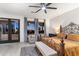 Cozy bedroom with a wrought iron bed, seating area, and natural light at 7631 N 20Th St, Phoenix, AZ 85020