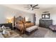 Bedroom with decorative wrought iron bed frame, dresser, and comfortable seating at 7631 N 20Th St, Phoenix, AZ 85020