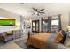 Spacious bedroom with a seating area, media center, and comfortable furniture at 7631 N 20Th St, Phoenix, AZ 85020