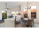 Elegant dining area with stylish decor, lighting, and a scenic outdoor view at 7631 N 20Th St, Phoenix, AZ 85020
