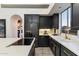 Modern kitchen featuring black cabinetry, white countertops, and updated appliances at 7631 N 20Th St, Phoenix, AZ 85020