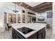 Open-concept kitchen with center island, modern stove top, and natural light at 7631 N 20Th St, Phoenix, AZ 85020