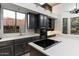 Modern kitchen featuring black cabinets, white countertops, and updated appliances at 7631 N 20Th St, Phoenix, AZ 85020
