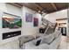 Living room with fireplace, comfortable seating, wood beams, and a staircase in view at 7631 N 20Th St, Phoenix, AZ 85020