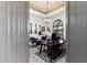 Home office featuring musical instruments and decor, with a large wooden desk at 7631 N 20Th St, Phoenix, AZ 85020
