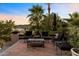 Outdoor patio with multiple chairs, coffee table, and shaded area at 7631 N 20Th St, Phoenix, AZ 85020