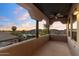 Outdoor patio with ceiling fan and scenic views of the surrounding landscape at dusk at 7631 N 20Th St, Phoenix, AZ 85020