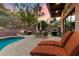 Spacious patio area with a refreshing pool, comfortable lounge chairs, and outdoor kitchen, ideal for outdoor living at 7631 N 20Th St, Phoenix, AZ 85020