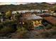 Gorgeous rear exterior view with covered patio and a private pool surrounded by desert landscaping at 7631 N 20Th St, Phoenix, AZ 85020