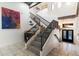 Elegant staircase with decorative tile risers and a convenient wet bar for entertaining at 7631 N 20Th St, Phoenix, AZ 85020