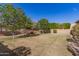 The spacious backyard is xeriscaped and has large shade trees at 870 E Tonto Pl, Chandler, AZ 85249