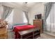 Comfortable bedroom featuring neutral walls, bench, and furnishings at 870 E Tonto Pl, Chandler, AZ 85249