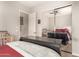 Bedroom with a mirrored closet reflecting bed, dresser, and crib at 870 E Tonto Pl, Chandler, AZ 85249