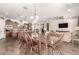 Open-concept dining area featuring views of the kitchen, living room and a dark wood table at 870 E Tonto Pl, Chandler, AZ 85249