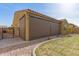 Exterior view of backyard, covered patio with shades, and xeriscaping at 870 E Tonto Pl, Chandler, AZ 85249