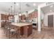 This open kitchen features a large island, stainless appliances, and pendant lighting at 870 E Tonto Pl, Chandler, AZ 85249