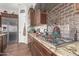 This gourmet kitchen features a stainless range hood and granite counters at 870 E Tonto Pl, Chandler, AZ 85249