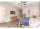 Spacious main bedroom featuring wood-look tile flooring and a ceiling fan at 870 E Tonto Pl, Chandler, AZ 85249
