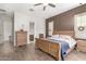 Cozy main bedroom suite features wood-look tile and neutral colors at 870 E Tonto Pl, Chandler, AZ 85249
