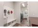Mud room with ample seating and storage, plus views to the laundry room at 870 E Tonto Pl, Chandler, AZ 85249