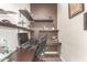 This office features a dark wood desk and floating shelves at 870 E Tonto Pl, Chandler, AZ 85249