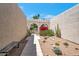 Private front courtyard featuring desert landscaping, stone pavers, and stucco walls at 8719 E San Marino Dr, Scottsdale, AZ 85258