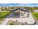 A spacious pavilion with picnic tables and barbecue grills provides a perfect spot for outdoor events in this community park at 8865 W Orange Dr, Glendale, AZ 85305