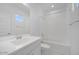 Bright bathroom featuring a tub-shower combo and a modern single sink vanity at 8865 W Orange Dr, Glendale, AZ 85305