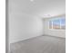 Bright bedroom with a large window and plush gray carpeting at 8865 W Orange Dr, Glendale, AZ 85305