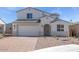 Charming two-story home with a well-manicured front yard and a two-car garage at 8865 W Orange Dr, Glendale, AZ 85305