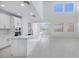 Kitchen featuring an island, modern appliances, white cabinetry, and ample counter space at 8865 W Orange Dr, Glendale, AZ 85305