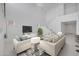 Spacious living room features high ceilings, large sofa, stylish decor, and abundant natural light at 8865 W Orange Dr, Glendale, AZ 85305