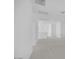 Upstairs landing features neutral carpet and bright white walls at 8865 W Orange Dr, Glendale, AZ 85305