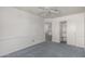 This carpeted bedroom has a ceiling fan and closet at 8911 E Sutton Dr, Scottsdale, AZ 85260
