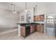 Spacious kitchen featuring granite countertops and stylish wooden cabinetry at 8911 E Sutton Dr, Scottsdale, AZ 85260