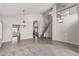 Bright and airy living room featuring tile flooring, carpet, a staircase, and views of a fireplace at 8911 E Sutton Dr, Scottsdale, AZ 85260