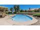 Backyard features a refreshing private pool with a concrete surround and rock landscaping at 8911 E Sutton Dr, Scottsdale, AZ 85260