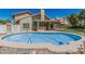 The property boasts a private pool, outdoor kitchen, patio, and well-maintained landscaping at 8911 E Sutton Dr, Scottsdale, AZ 85260