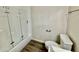 Clean bathroom featuring toilet, wood-look floors, glass shower door with modern fixtures at 9555 E Raintree Dr # 1055, Scottsdale, AZ 85260