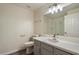Bathroom featuring white countertop and gray cabinets, toilet and mirror plus a walk-in shower at 9555 E Raintree Dr # 1055, Scottsdale, AZ 85260