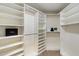 Spacious walk-in closet with custom shelving and ample storage at 9555 E Raintree Dr # 1055, Scottsdale, AZ 85260