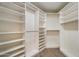Spacious walk-in closet with ample shelving and wood-look flooring offers an abundance of storage at 9555 E Raintree Dr # 1055, Scottsdale, AZ 85260