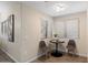 Cozy dining nook with a modern table set near a bright window at 9555 E Raintree Dr # 1055, Scottsdale, AZ 85260