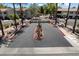 Upscale gated community featuring a lush desert landscape with palm trees and well-manicured shrubbery at 9555 E Raintree Dr # 1055, Scottsdale, AZ 85260