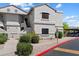 Exterior shot of condo building with covered parking and landscaping at 9555 E Raintree Dr # 1055, Scottsdale, AZ 85260