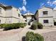 Beautifully maintained building featuring lush landscaping and inviting walkways at 9555 E Raintree Dr # 1055, Scottsdale, AZ 85260