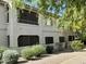 Well-maintained condo exterior with lush landscaping and ample natural light at 9555 E Raintree Dr # 1055, Scottsdale, AZ 85260