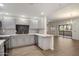 Remodeled kitchen showcasing gray cabinets, stainless steel appliances, modern countertops, and open-concept dining at 9555 E Raintree Dr # 1055, Scottsdale, AZ 85260